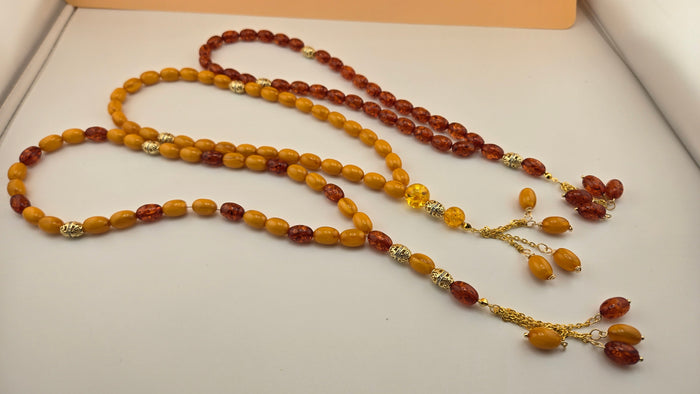 Golden Honey Tasbih with amber and honey-toned beads and ornate gold-tone spacers