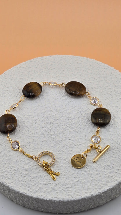 Tiger Eye Luxe Bracelet with brown tiger eye beads and dangling gold-tone charms