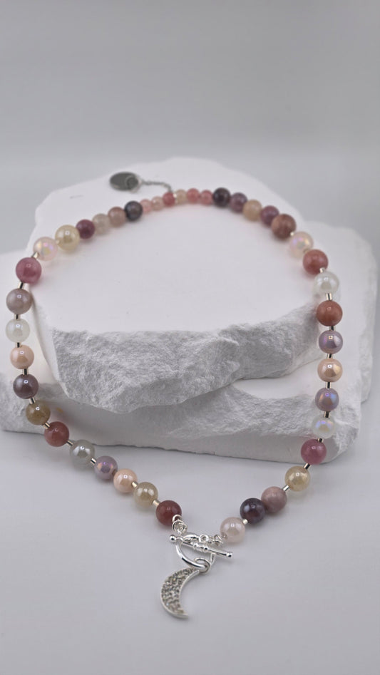 Lunar Dream Gemstone Moon Necklace with pink, purple, cream and gray stones and a moon charm