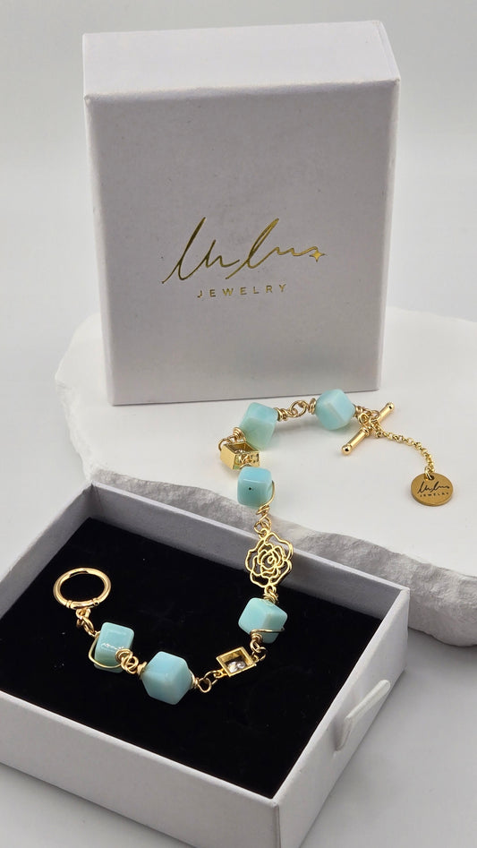Ocean Bloom Aqua Jade Bracelet with aqua-blue jade stones and a gold-tone rose