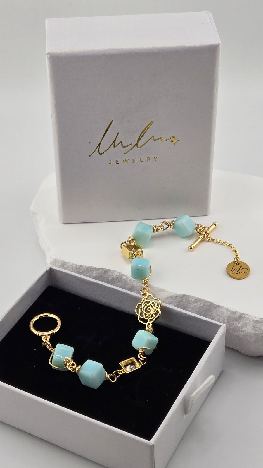Ocean Bloom Aqua Jade Bracelet with aqua-blue jade stones and a gold-tone rose