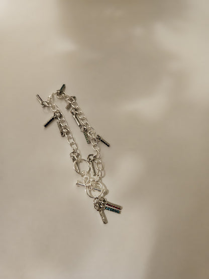 Chain Glow Silver-Tone Bracelet with oval links and dangling dark accents, view 2