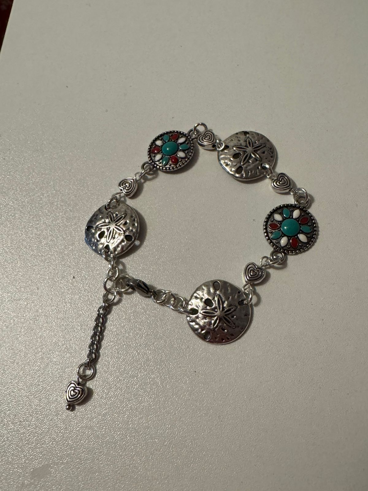 Woman wearing elegant Nature-Inspired Silver & Turquoise Bracelet on her wrist