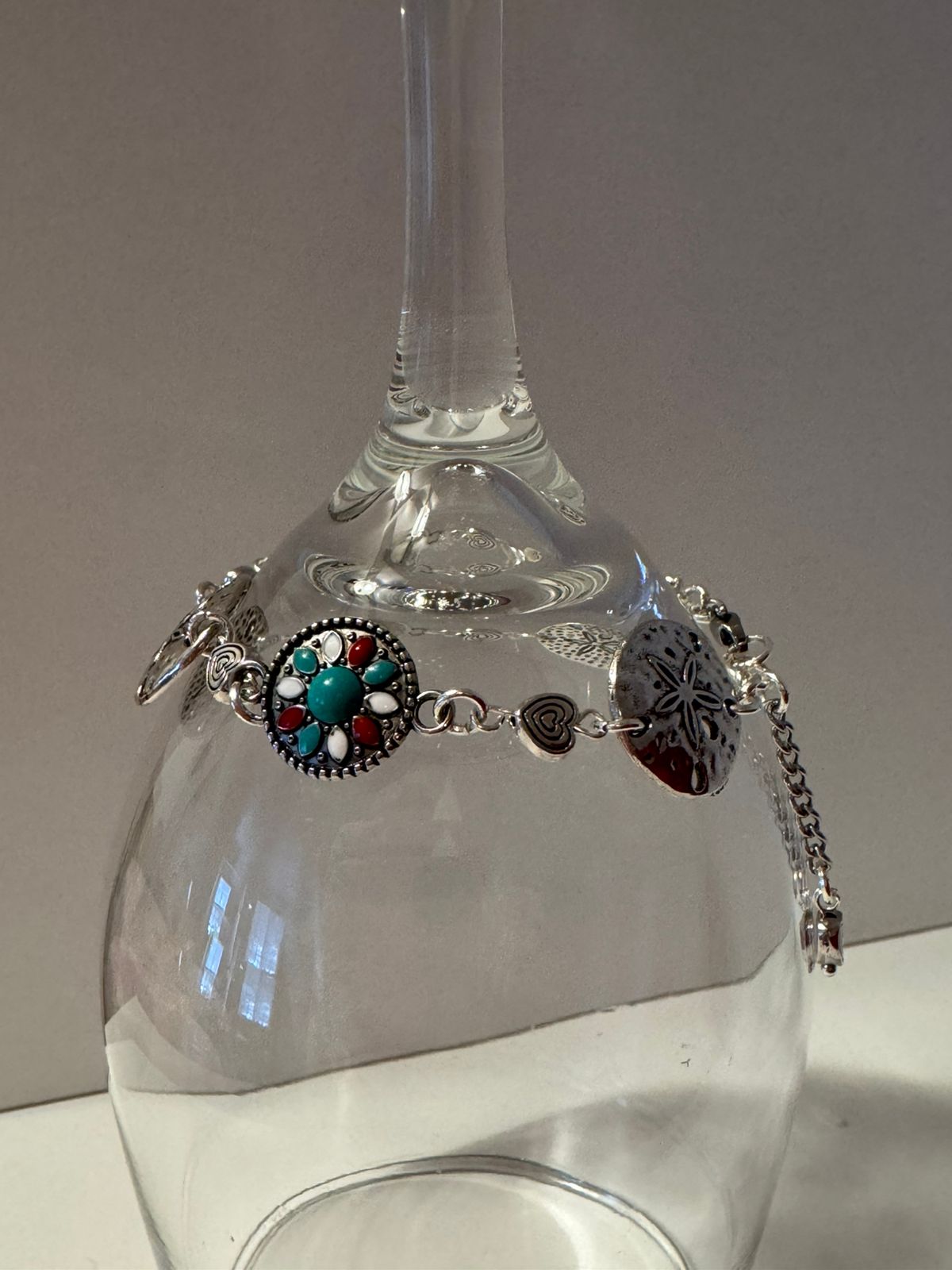 Handcrafted silver botanical elements with embedded turquoise gemstones