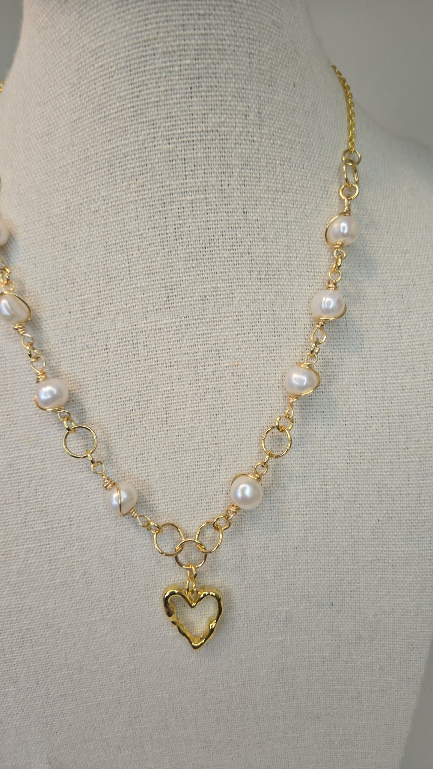Close-up of Sacred Heart Charm Bracelet with intricate detailing