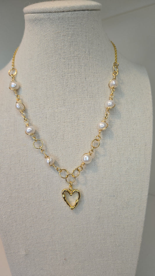 Open Heart Pearl Necklace on a display bust, full view