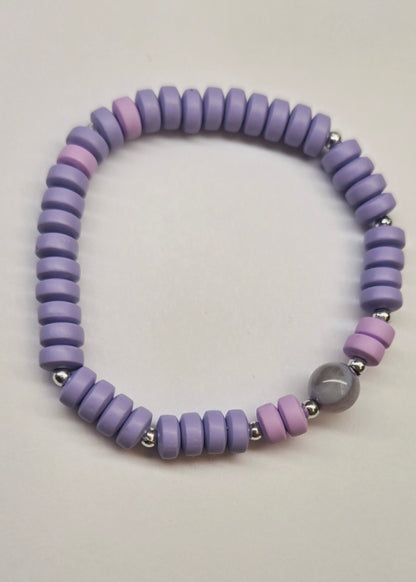 Minimalist Heishi Bead Bracelet with purple and pink heishi beads and a round stone bead, view 3
