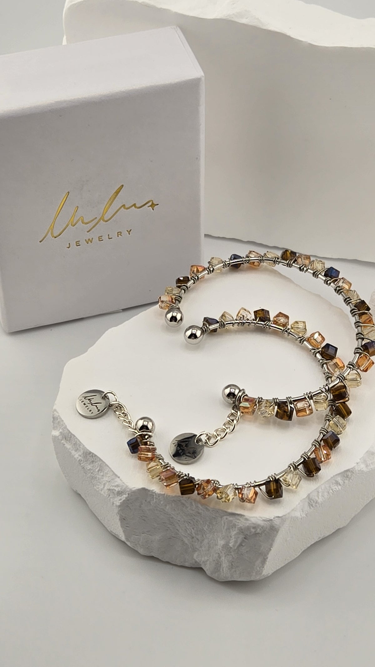 Caramel Prism Bangle, two hand-wire-wrapped bangles with champagne, peach and brown cube beads, shown with LuluTouch gift box