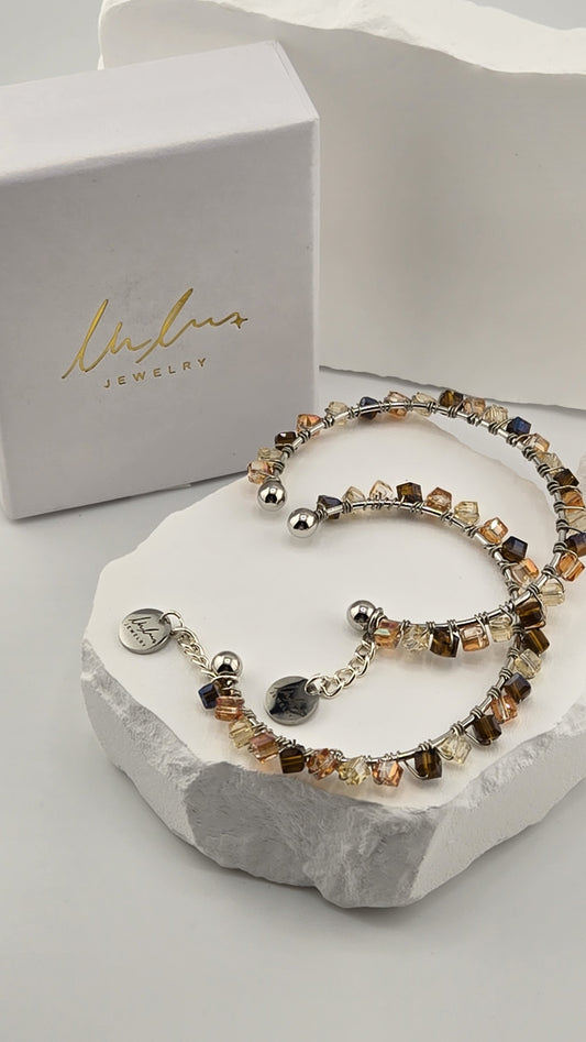 Caramel Prism Bangle, two hand-wire-wrapped bangles with champagne, peach and brown cube beads, shown with LuluTouch gift box