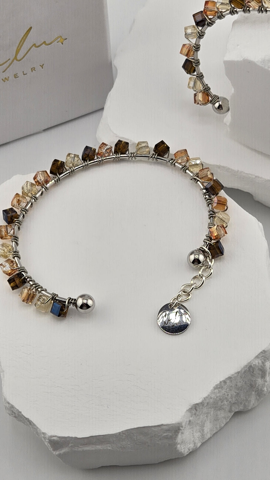 Caramel Prism Bangle with faceted cube beads, ball ends and logo charm, view 2