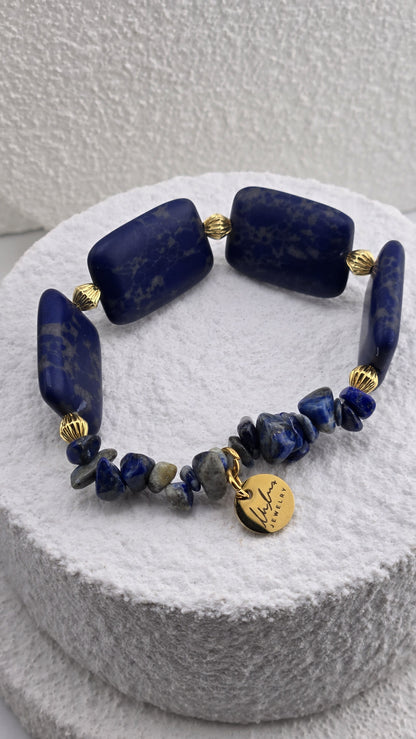 Close view of the Cobalt Tile Bracelet blue chip stones and gold-plated charm