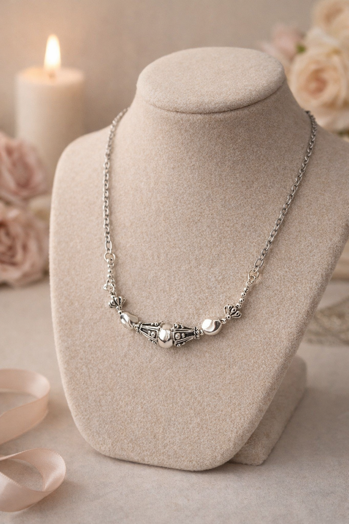 Silver Purity Necklace in silver-tone stainless steel with decorative center details