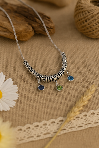 Drops of Dawn Blue Accent Necklace with blue-green drops on an ornate silver-tone chain, view 3
