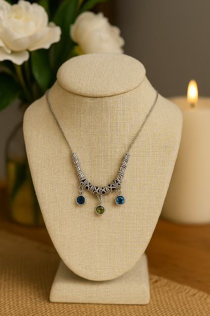 Drops of Dawn Blue Accent Necklace with blue-green drops on an ornate silver-tone chain