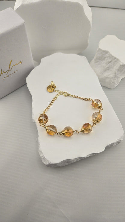 Firefly Orb Bracelet beside the LuluTouch gift box
