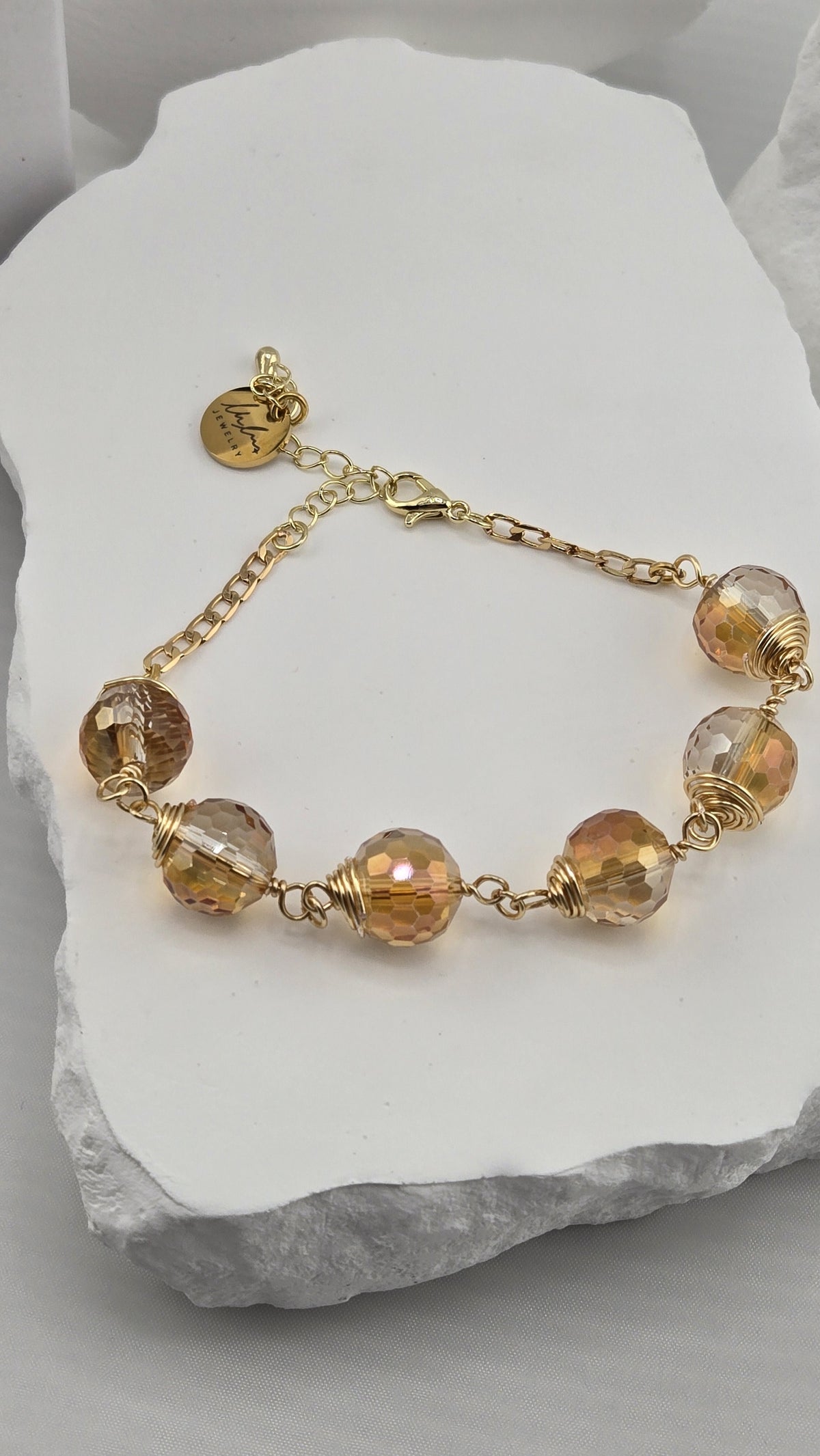 Firefly Orb Bracelet with six wire-wrapped faceted champagne beads
