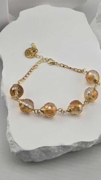 Firefly Orb Bracelet with six wire-wrapped faceted champagne beads