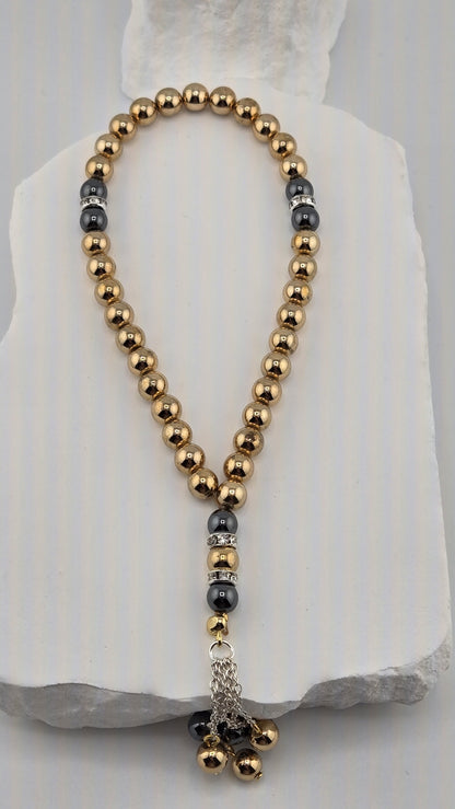 Gilded Dusk Tasbih with gold-tone and dark gray hematite beads