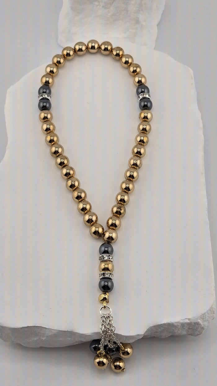 Gilded Dusk Tasbih with gold-tone and dark gray hematite beads