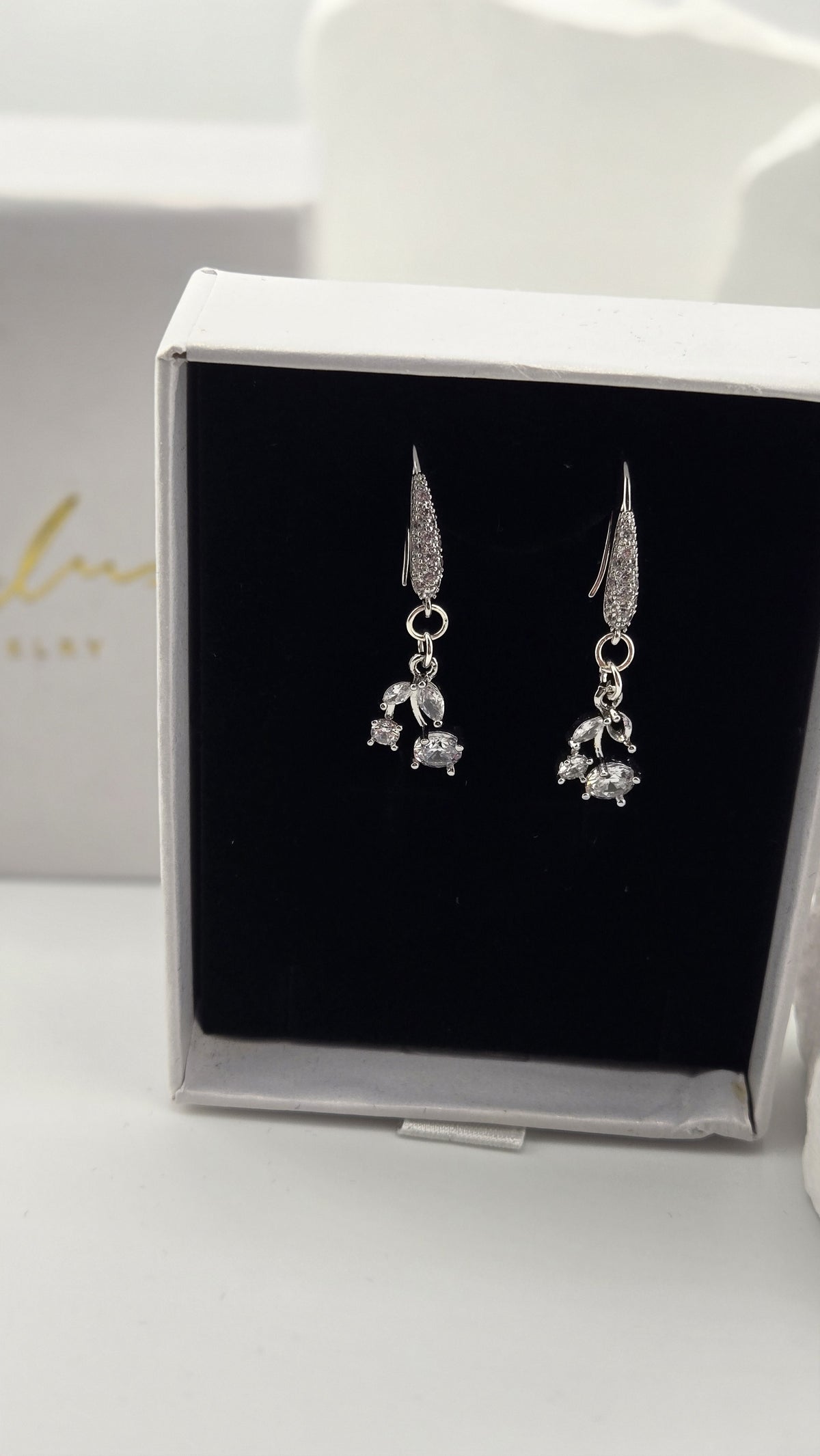 Glimmer Drop Earrings close view showing the stone-lined hooks