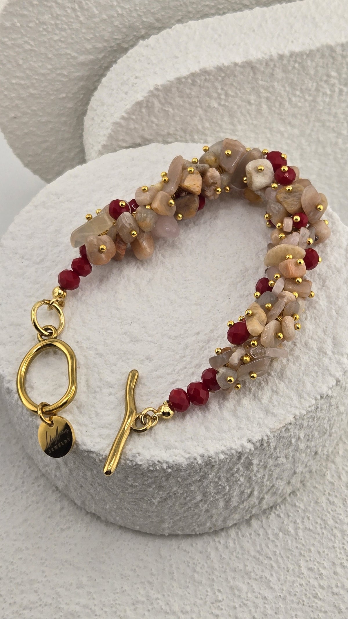 Harvest Toggle Bracelet open, showing the sculpted gold-plated toggle and LuluTouch tag