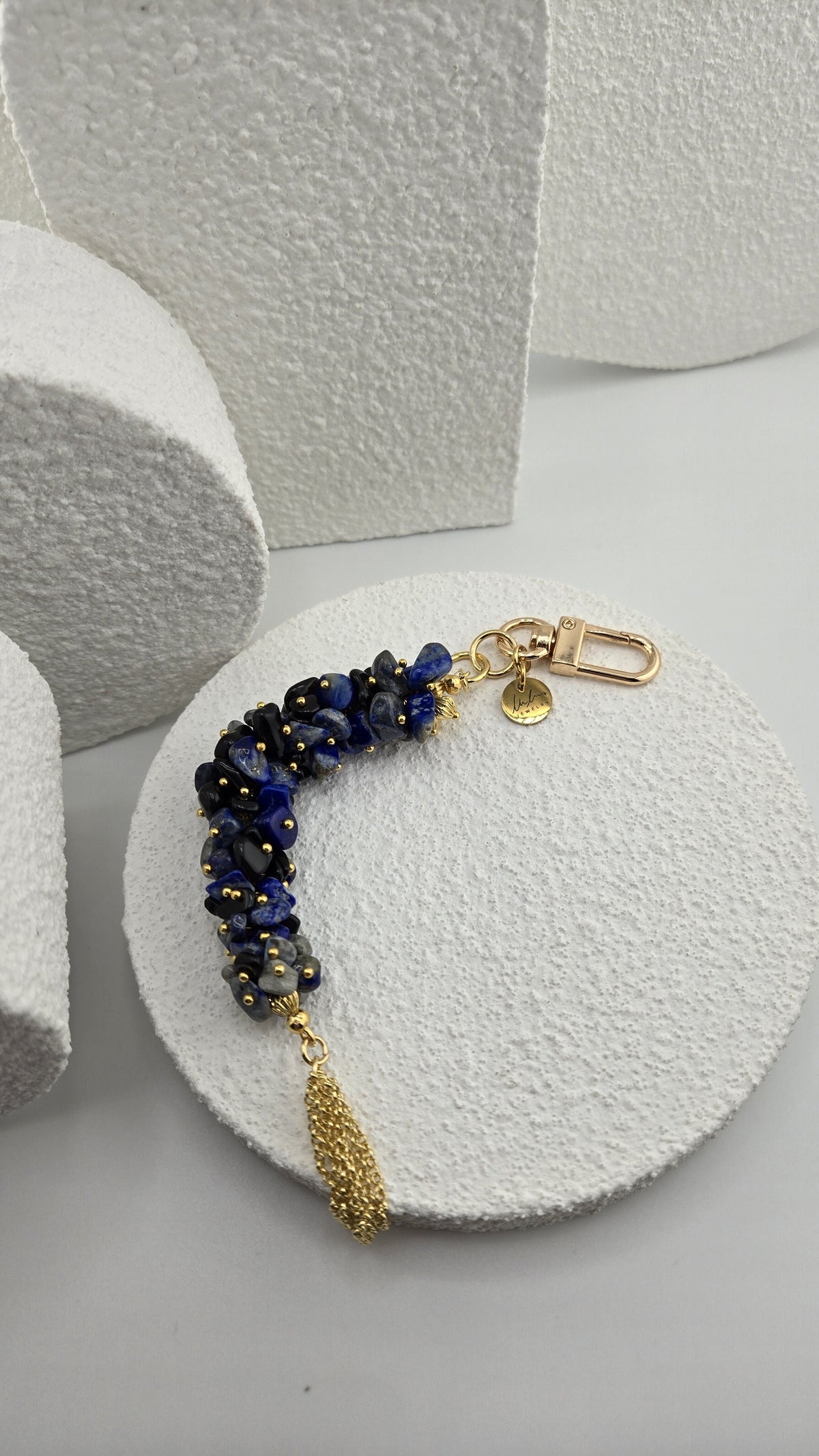 Indigo Tassel Bag Charm with its clip clasp and LuluTouch charm, view 2