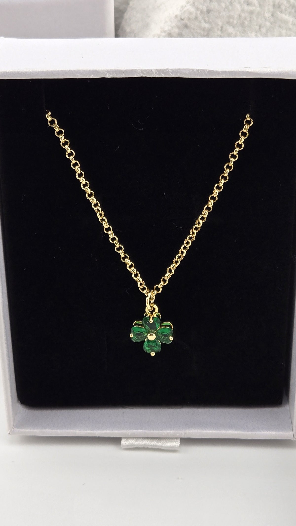 Meadow Clover Necklace in green, four-leaf clover pendant with heart-shaped green stones on a gold-plated chain in a LuluTouch gift box