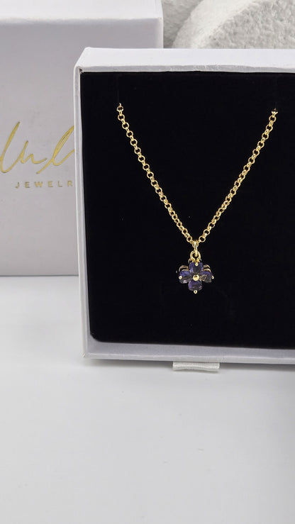 Meadow Clover Necklace in purple, four-leaf clover pendant with heart-shaped purple stones on a gold-plated chain in a LuluTouch gift box