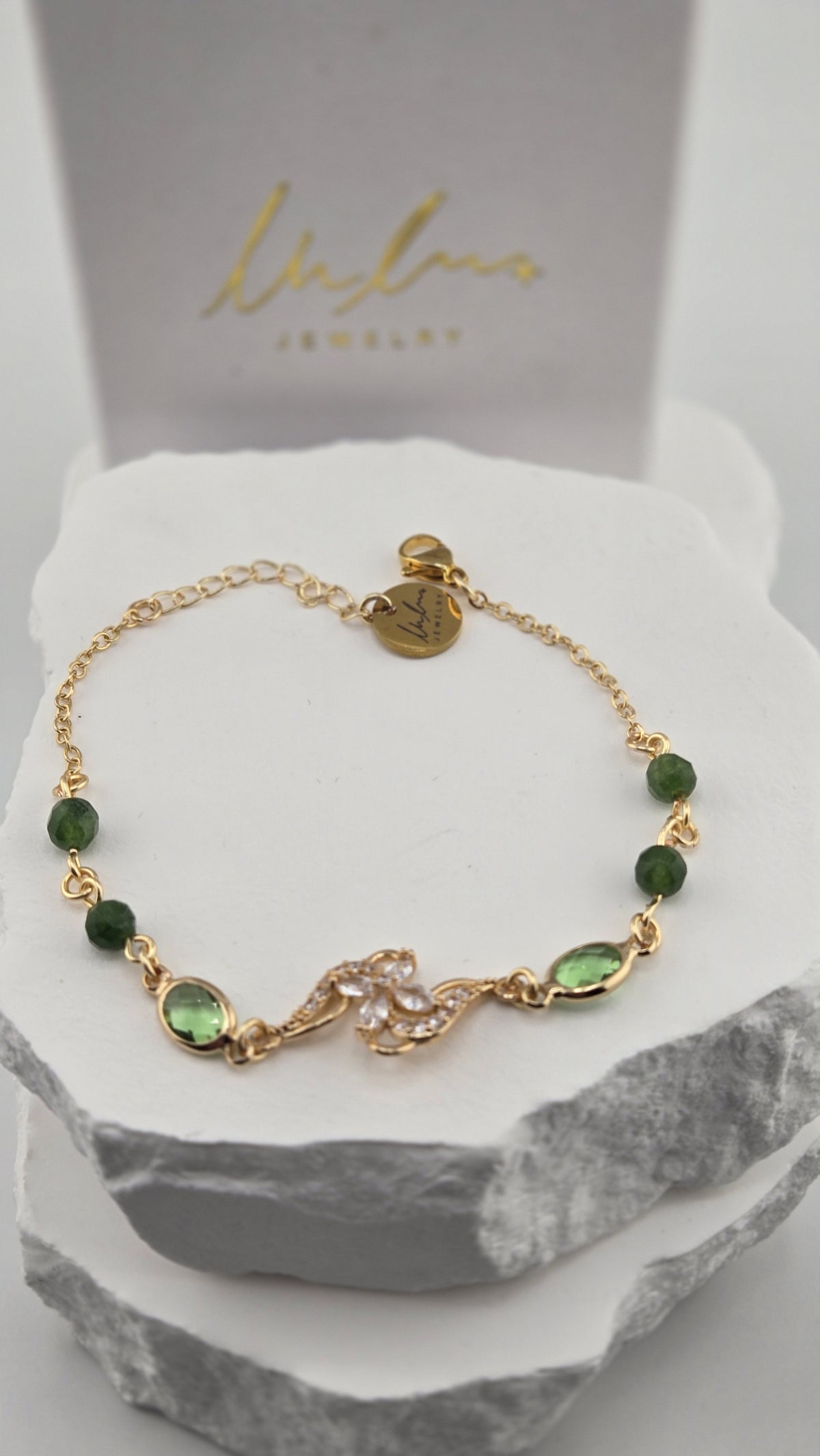 Olive Swirl Bracelet in front of the LuluTouch gift box