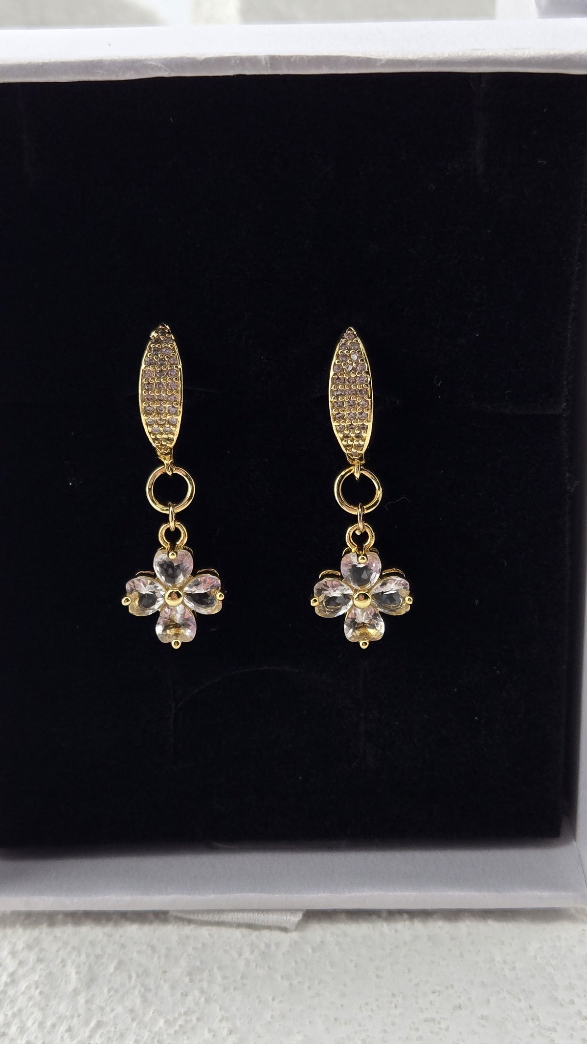Quatrefoil Drop Earrings, clear four-leaf charms with heart-shaped stones under slim gold-plated pavé tops