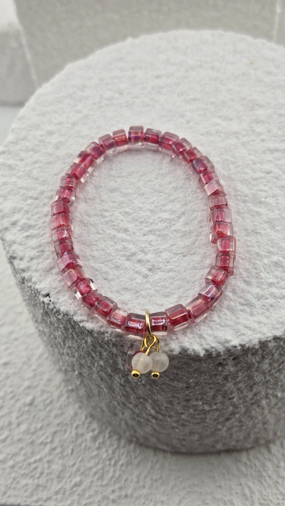 Rosewater Bead Bracelet showing the frosted white bead charm with gold-tone accents