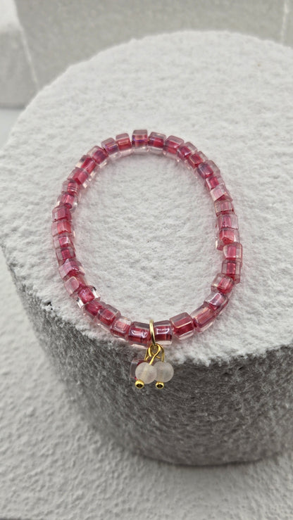 Rosewater Bead Bracelet showing the frosted white bead charm with gold-tone accents