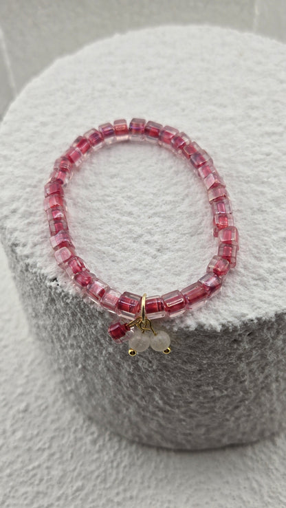 Side view of the Rosewater Bead Bracelet pink cube beads