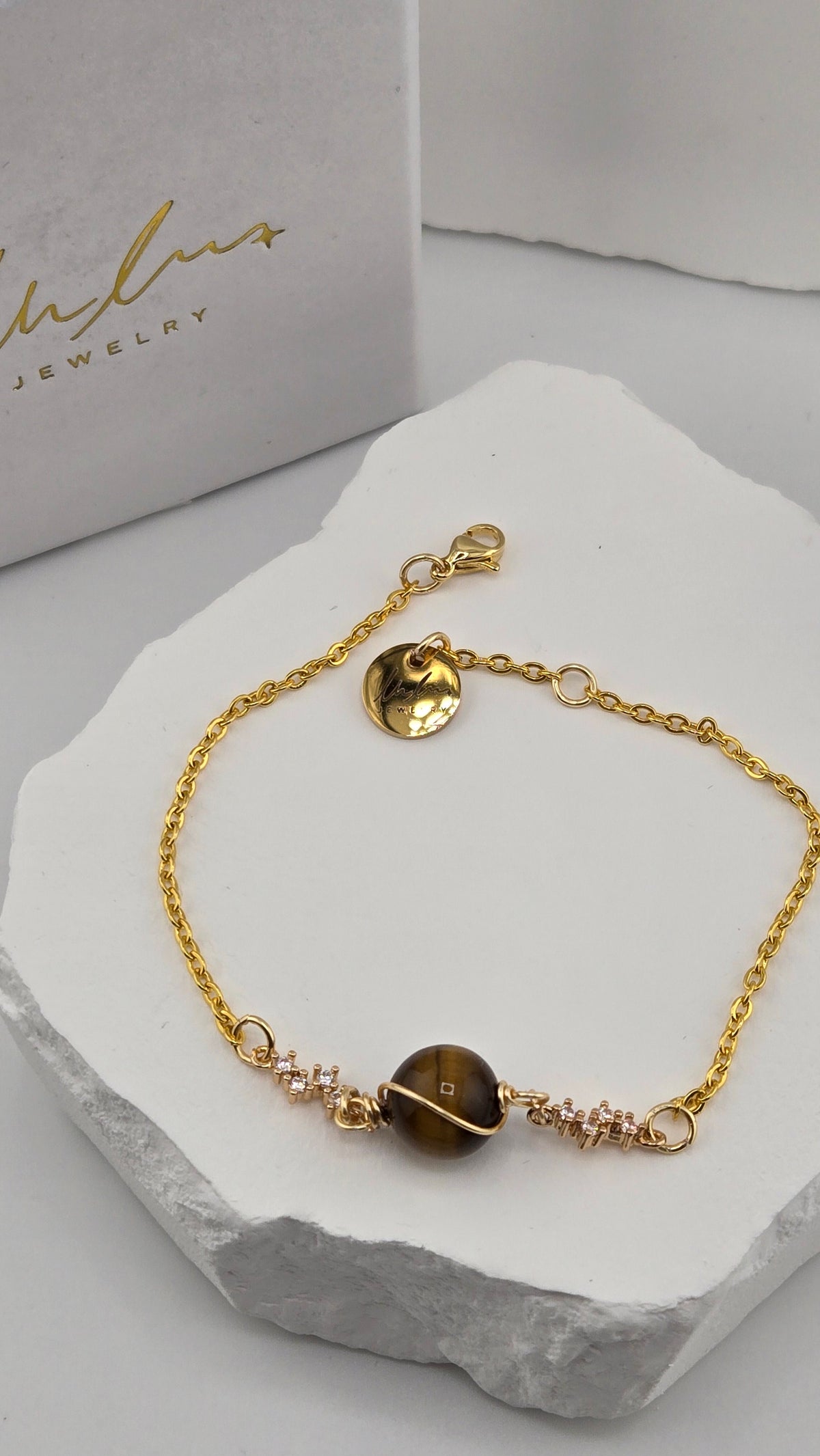 Saturn Tiger's Eye Bracelet, wire-wrapped tiger's eye bead with cubic zirconia spacers on a gold-plated chain