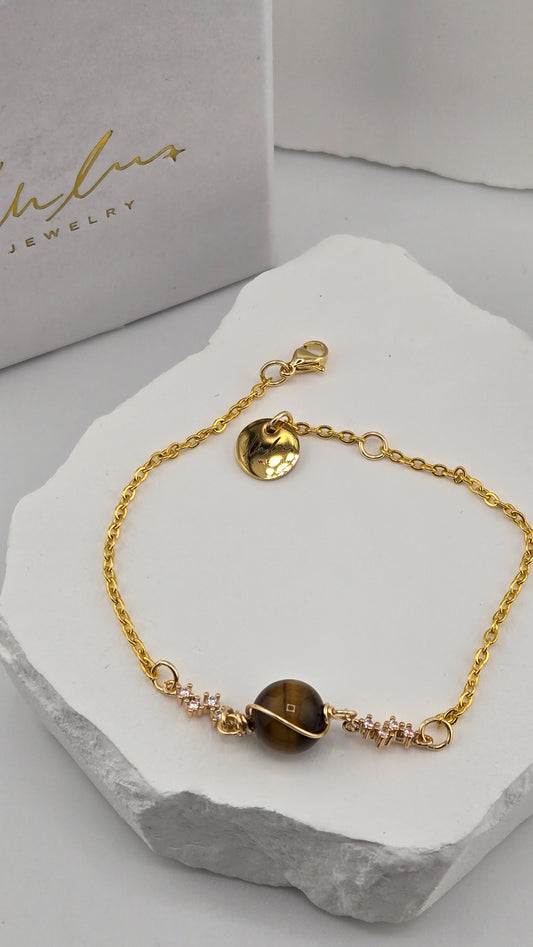 Saturn Tiger's Eye Bracelet, wire-wrapped tiger's eye bead with cubic zirconia spacers on a gold-plated chain