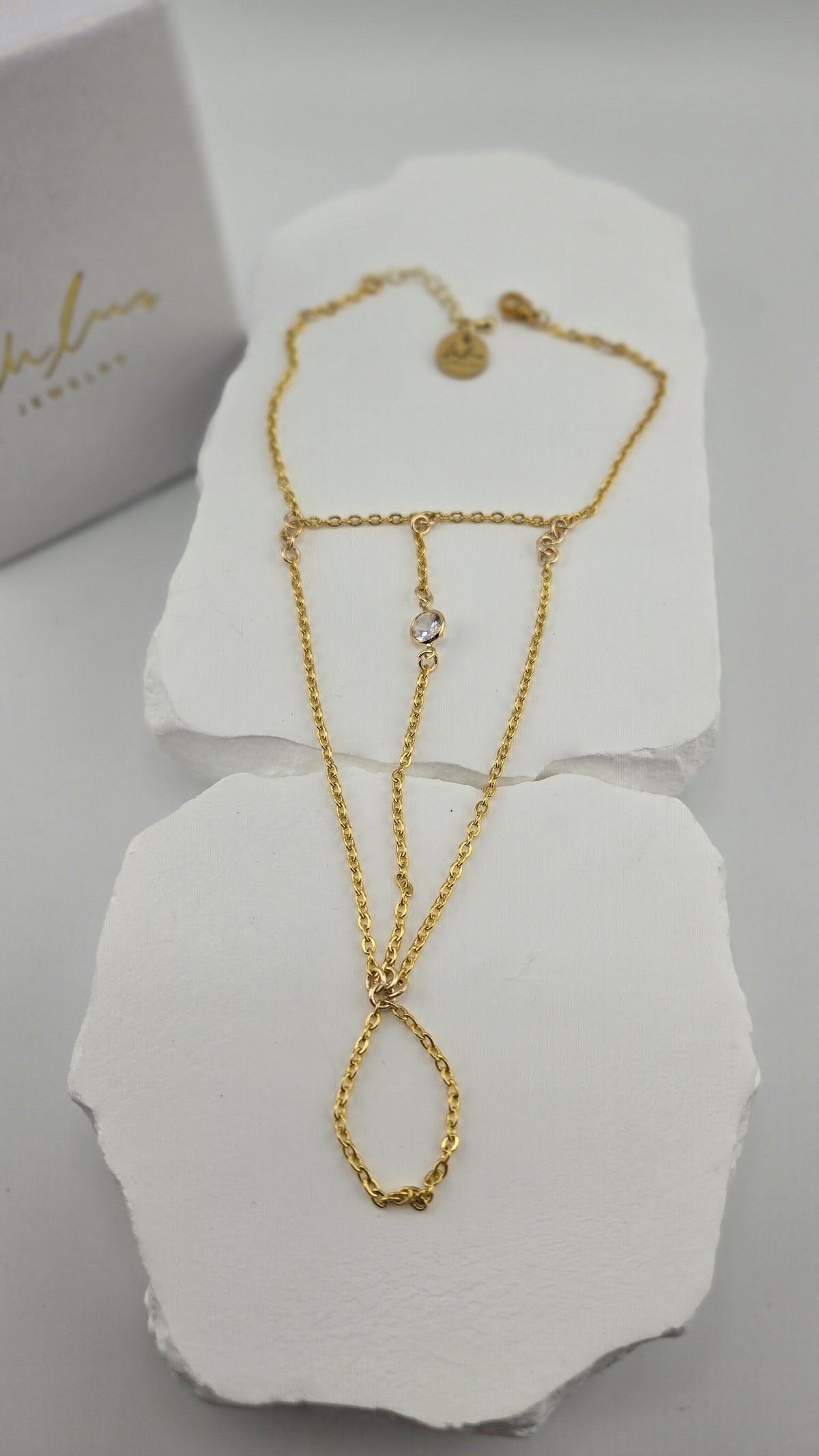 Solitaire Hand Chain close view of the clear stone and finger loop