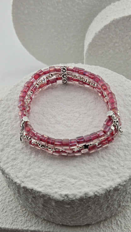 Starlit Raspberry Bracelet on a white stone stand, view 2