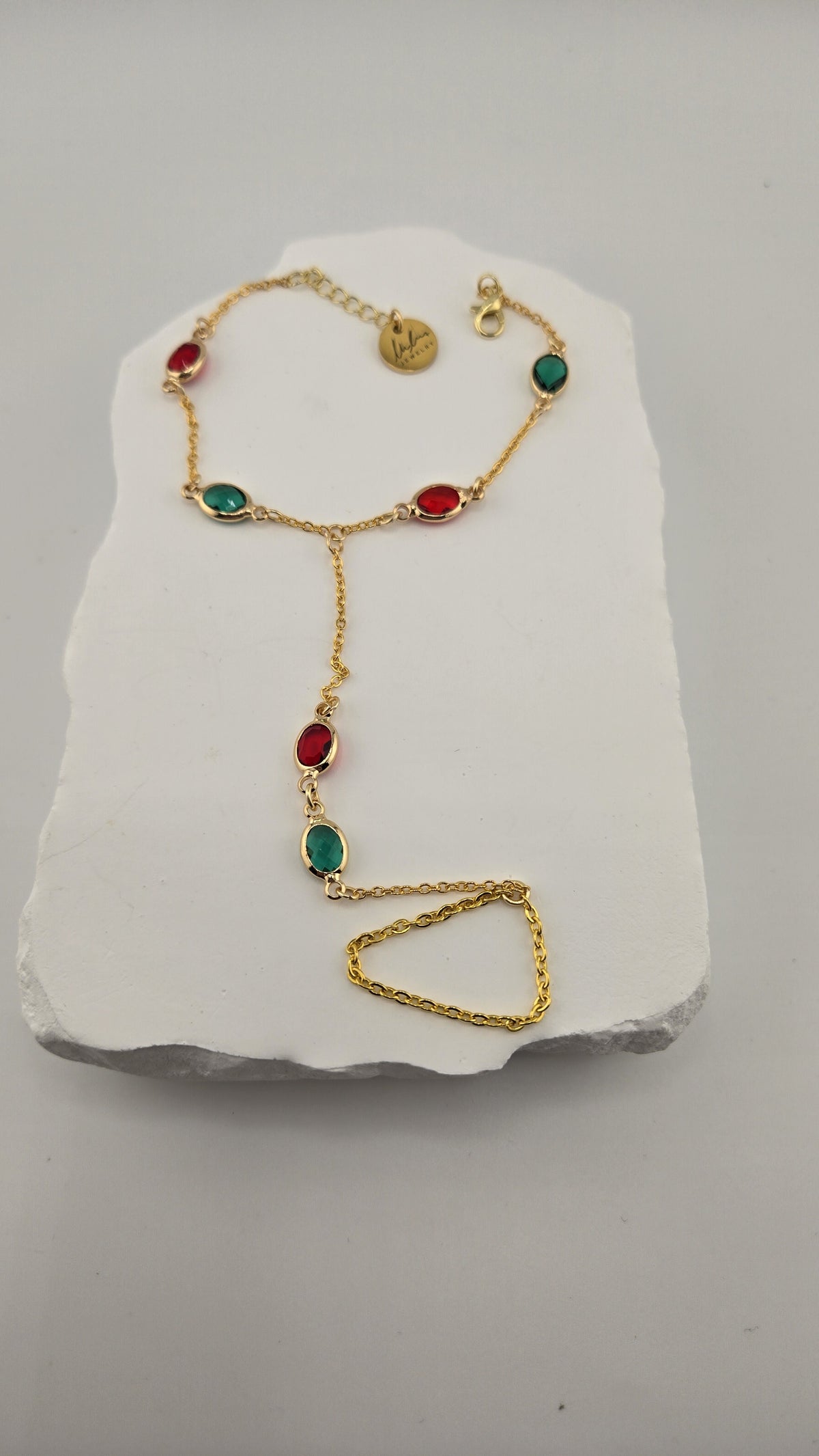 Sultana Hand Chain laid flat showing the bracelet, stones and finger loop