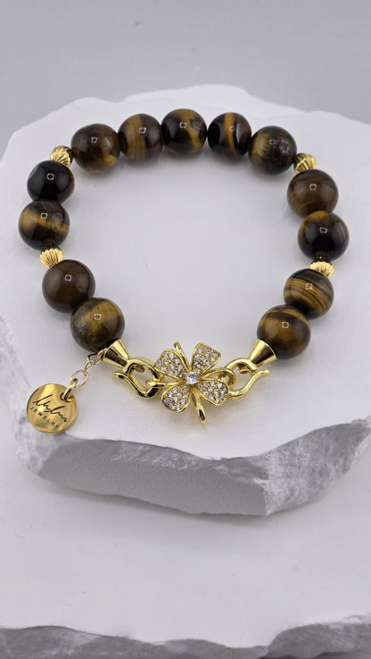 Gold-plated flower clasp set with clear stones and LuluTouch tag