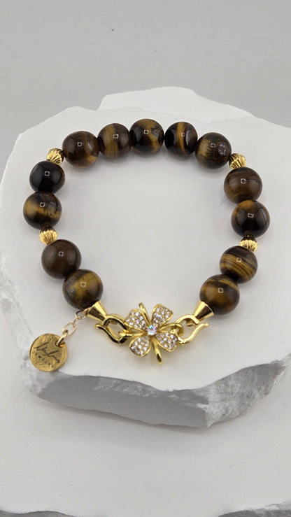Tawny Flower Tiger's Eye Bracelet on a white stone