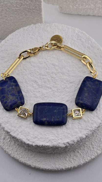Close view of the Ultramarine Link Bracelet blue beads and gold chain